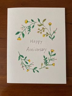 a card with the words happy anniversary written on it and yellow flowers in a circle