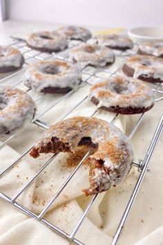 there are many donuts that have been cooling on the rack for desserts to be eaten