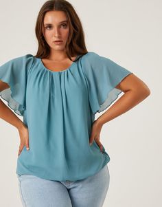 If you are looking for a simple, flattering blouse for work or school, look no further. The Curve Chiffon Flutter Sleeve Blouse is the ultimate smart-casual top. This top features short flutter sleeves, a button at the back of the neck, and a gathered hem at the bottom. The material is a non-stretchy chiffon that is lined except for on the sleeves. This blouse is made from 100% polyester and the lining is 95% polyester and 5% spandex. Hand wash cold. Imported. Model is wearing a size 1XL. Flowy Short Sleeve Blouse For Work, Flowy Blouse With Flutter Sleeves For Work, Elegant Flowy Top With Flutter Sleeves, Casual Butterfly Sleeve Tops For Workwear, Casual Tops With Butterfly Sleeve For Workwear, Casual Workwear Top With Butterfly Sleeves, Flowy Solid Color Short Sleeve Tops, Solid Short Sleeve Flowy Tops, Casual Workwear Blouse With Butterfly Sleeves