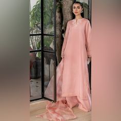 Zainab Zulfiqar - 3 Piece Pakistani Suit Size Small Perfect Condition - Worn Once Nazli, The Coral Pink Long Line Kameez Comes With Two Tone Embroidered Neckline And Is Paired With Floor Length, Wide-Leg Pants. The Set Is Made In Pure Bamber Raw Silk And Comes With A Tie And Dye Contrast Dupatta In Pure Organza And Tassels. Pink Lawn Suit For Eid, Pink Lawn Suit For Formal Eid Occasions, Formal Pink Lawn Suit For Eid, Pink Formal Lawn Suit For Eid, Formal Long Sleeve Palazzo Set With Naqshi Embroidery, Formal Long Sleeve Palazzo Set With Naqshi Detail, Formal Long Sleeve Palazzo Set With Naqshi, Zainab Zulfiqar, Contrast Dupatta