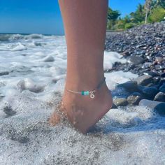 The perfectly beachy summer accessory for your ankle, personalised with a silver initial tag. Half coloured Japanese seed beads, on elastic, half sterling silver chain. With a silver fish and 3 handmade glass beads. Choose from Pink, Orange, Blue or Aqua.  Toning beads may vary from the photos, but they'll look great together, trust me! Each anklet is finished with sterling silver lobster clasp and a half inch extender chain. Small measures 8.5" to 9", Medium measures 9" to 9.5", Large measures Handmade Silver Strand Anklets, Ocean-inspired Strand Anklets As A Gift, Silver Beach Jewelry With Tiny Beads, Silver Anklets With Tiny Beads For Beach, Silver Beaded Bracelets With Tiny Beads For Beach, Silver Beaded Bracelets As Summer Gift, Silver Beaded Bracelets For Summer Gift, Beachy Anklets, Coastal Jewelry