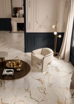 an elegant living room with marble floors and gold accents on the walls, along with two white armchairs