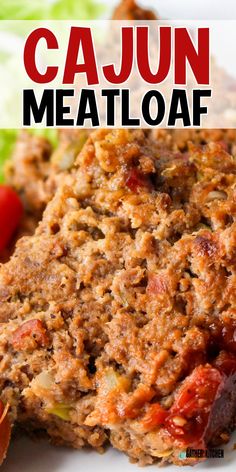 a close up of meatloaf on a plate with lettuce and tomatoes