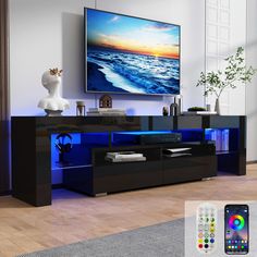 an entertainment center in a living room with a tv on the wall and remote control