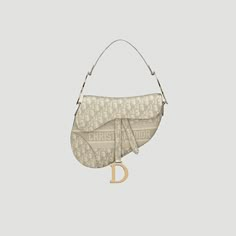 a white purse with the letter d hanging from it's shoulder and two handles