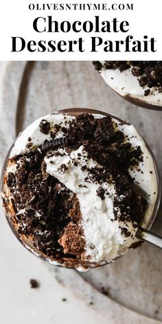 chocolate dessert parfait with whipped cream and oreo cookies in the middle on a plate