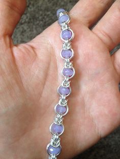 "This beautiful bracelet was made using the \"Dreaming in Mail\" pattern.   Bracelet is made from sterling silver filled jump rings, high quality lavender agate rondelles, and is a beautiful, feminine interpretation on chainmaille!  Bracelet is 7.5\" long, clasped with an elegant sterling silver lobster, and can be adjusted shorter if need be.  I hope you love your new bracelet, and feel free to contact me with any questions!  Infinite Love and Gratitude!  *See something you like here, but had a Chainmaille Jewelry Patterns, Chain Maille Patterns, Jump Ring Jewelry, Chainmaille Jewelry, Chainmail Bracelet, Tiffany And Co Jewelry, Pattern Bracelet, Chainmail Jewelry, Steam Punk Jewelry