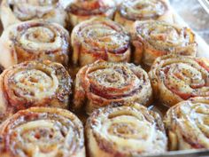 there are many cinnamon rolls in the pan