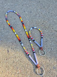 a pair of lanyards that are laying on the ground