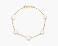 14K Yellow Gold Freshwater Cultured Pearl Station Bracelet. Modern meets classic in this luxurious bracelet. Worn alone or paired with multiple bracelets, this piece will add elegance to any look.