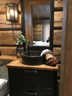 a bathroom with a sink, mirror and toilet