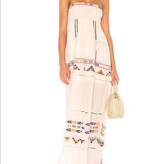 Nwt Xs Beautiful White Embroidered Tularosa Maxi Dress Felicity Embroidered Dress Self: 100% Viscose Lining: 100% Cotton Hand Wash Cold Partially Lined Embroidered Lightweight Fabric With Laddered Trim Boned Sides Smocked Back Panel Neckline To Hem Measures Approx 51" In Length Imported Summer White Maxi Dress With Embroidered Hem, Embroidered Maxi Dress For Brunch, White Maxi Dress With Embroidered Hem For Beach, White Embroidered Dress With Geometric Pattern For Vacation, White Embroidered Sleeveless Maxi Dress, White Embroidered Maxi Dress For Summer, White Maxi Dress With Geometric Embroidery, White Embroidered Maxi Dress For Spring, Maxi Dress Wedding Guest