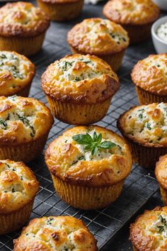 several muffins with cheese and herbs on a cooling rack