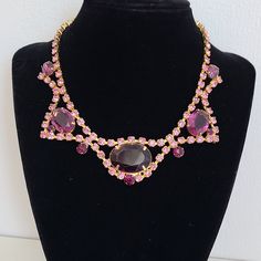 Exquisite Vintage Choker Bib Necklace Massive Purple Rhinestones with Light Pink Rhinestones in Gold-tone Setting. A beautiful necklace with a lovely open-back and closed-back rhinestone contributes to the exceptional shine and color combination. In excellent vintage condition. Perfect piece for a special occasion. Please note, that the size of the bust is smaller than average, and the necklace position on the body might differ from how it's pictured. For new arrivals check the shop's Instagram Vintage Choker, Rhinestone Choker, Purple Rhinestone, Pearl Brooch, Pink Rhinestones, Choker Necklaces, Lovely Jewellery, Bib Necklace, Vintage Rhinestone