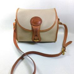 1993 Vintage Dooney & Bourke All Weather Leather Bone & British Tan R25 Medium Essex Shoulder Bag, Dooney & Bourke Purse, Dooney & Bourke Pebble Bone Leather And Smooth British Tan Leather Trim. Classic Dooney & Bourke Look. Dimensions: 10.25”W X 8”H X 4.5”D Condition: Used. Good Vintage Condition. Some Pen Marks. As Pictured. No Other Issues. Shipped With Usps Priority Mail #Dooney Everyday Handbag Dooney & Bourke, Dooney And Bourke Handbags Dooney & Bourke, Satchel Handbags Dooney & Bourke, Dooney And Bourke Handbags Outlet, Dooney Bourke Crossbody Handbags, Dooney Bourke Shoes, Dooney Bourke Handbags Dooney & Bourke, Dooney Bourke Handbags Hobo Shoulder Bags, Dooney & Bourke Bags Dooney & Bourke