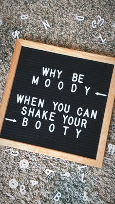 a sign that says why be moody when you can shake your boooty