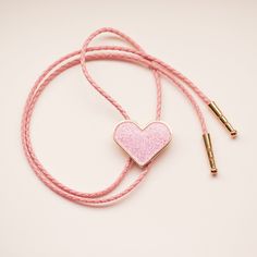 Howdy! This li'l bolo tie is comprised of: 1.5" Hard Enamel Charm Gold Plated Tips and Bolo Back 32" vegan leather cord Need a different cord color or length? Just let us know in the notes at checkout! Pink Bolo Tie, Women Bolo Tie Outfit, Diy Bolo Ties, Bolo Tie Women Outfit, Bolo Tie Outfit, Diy Bolo Tie, Bolo Tie Women, Wedding Bolo Tie, Collar Ideas