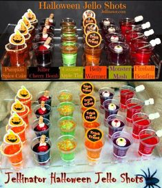 halloween jello shots are arranged in plastic cups