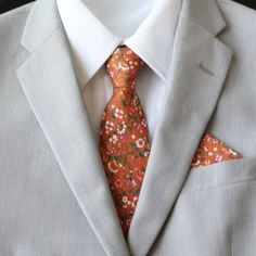 Adult Skinny Regular Length Necktie:  approximately 2.5-2.75 inches wide and 58 inches long Pocket Square:  approximately 9 inches by 9 inches Color:  Burnt Orange Floral Material:  Cotton RETURN/EXCHANGE POLICY:  Please notify/message seller regarding an exchange and/or return within 30 days after delivery of package to open a case and we will walk you through the next steps.     CUSTOMER SERVICE:  We strive to provide the best customer service and products to our customers.  Please don't hesit Red Wedding Suit And Tie Accessories With Pocket Square, Red Wedding Suit And Tie Accessories, Fitted Wedding Suits With Pocket Square, Red Wedding Pocket Square, Fitted Suit And Tie Accessories For Groom, Red Pocket Square For Wedding, Red Dapper Tie For Wedding, Red Dapper Ties For Wedding, Groomsmen Tie