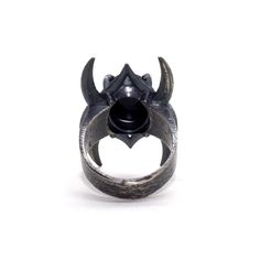 Inspired by Lord of The Rings and crown of the Nazgul. This ring pulses with dark power and raw strength. Each ring is set with a high quality black onyx. I hand texture each ring with a raw, multidirectional pattern to accentuate the stone’s physicality. Hand cast in sterling silver, oxidized and finished to 400 grit Need your size in a quarter size? Feel free to reach out before or during purchasing. *Please note: all pieces take 2-3 weeks to complete Black Metal Skull Ring Symbolic Style, Symbolic Black Metal Skull Ring, Adjustable Black Skull Ring, Black Symbolic Adjustable Rings, Symbolic Hand Forged Open Ring, Symbolic Black Promise Ring, Symbolic Black Jewelry For Promise, Symbolic Black Promise Ring Jewelry, Hand Forged Open Symbolic Ring