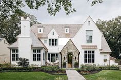 a large white house with lots of windows