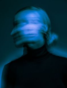 a blurry image of a person in black shirt