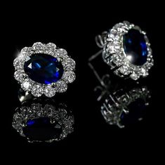 Kate Royal Sapphire and Clear 2.5 Carat Cubic Zirconia Silver Stud Earrings Kate Royal Sapphire Halo Stud style is created with best quality sparkling Blue Cubic Zirconia, Clear CZ Accents with Genuine Rhodium Finish. This classic sapphire studs are the piece that every woman must have in their jewelry box. This piece will dress up your casual and event outing with the perfect sparkles. Item: BSJ-SE150119R30 Plating Color: Silvertone Rhodium Base Metal: Lead Free Alloy (Brass) Gemstone Grade: AA Blue Sapphire Jewelry, Sapphire Stud Earrings, Halo 2, Celebrity Jewelry, Sapphire Earrings Studs, Sapphire Studs, Book Jewelry, Cubic Zirconia Jewelry, Cz Jewelry