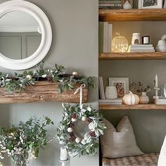 the shelves are decorated with wreaths and candles