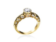 a gold ring with diamonds on it