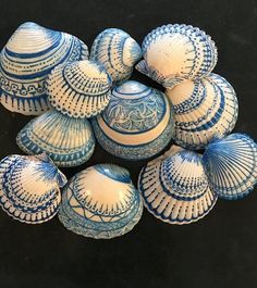 several blue and white vases sitting on top of each other