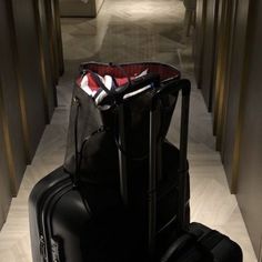 two pieces of luggage sitting on the floor