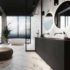 a large bathroom with marble floors and walls, along with round mirrors on the wall