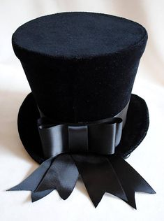 Elegant Black Hat For Costume, Elegant Top Hat For Halloween Party, Elegant Black Costume Hat, Black Top Hat For Winter Party, Elegant Black Top Hat For Halloween, Elegant Black Top Hat For Costume, Elegant Winter Costume Hats And Headpieces, Elegant Black Costume Top Hat, Black High Crown Top Hat For Costume