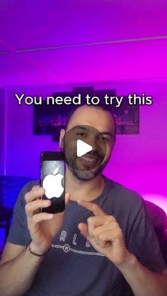 a man holding an iphone in front of his face with the caption you need to try this