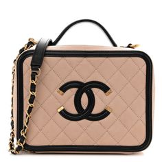 This is an authentic CHANEL Caviar Quilted Medium CC Filigree Vanity Case in Beige and Black. This chic stylishtravel bag is crafted of luxurious diamond quilted caviar leather in beige with black trim. This elegant shoulder bag features anaged gold chain link black leather threaded shoulder strap, a black handle and a large Chanel CC stitched logo with aged gold accents on the front. The two zippers open all around to a partitioned black leather interior with zipper pockets. Designer Rectangular Bag With Diamond Quilting, Designer Formal Bags With Diamond Quilting, High-end Quilted Bags For Formal Occasions, Designer Diamond Quilted Formal Bags, High-end Quilted Formal Bag, High-end Formal Quilted Bags, Luxury Evening Bag With Diamond Quilting, Luxury Diamond Quilted Evening Bag, High-end Quilted Rectangular Shoulder Bag