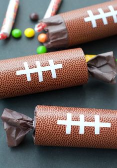 football themed candy wrappers with chocolate candies in the shape of crosses on them