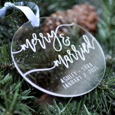 a glass ornament hanging from a christmas tree