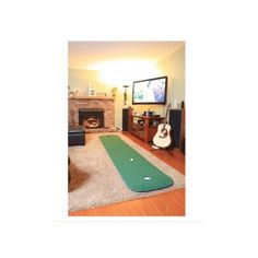 a living room filled with furniture and a flat screen tv mounted to the side of a wall