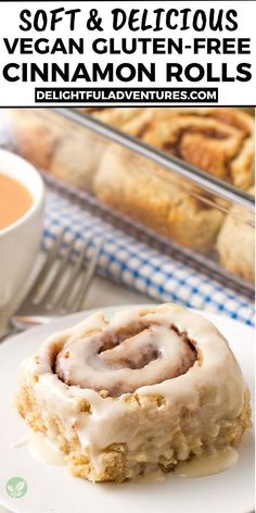 a cinnamon roll on a plate with coffee and other food in the background that is also vegan gluten - free