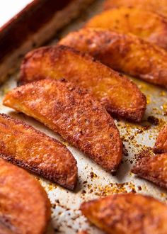 fried fish fillets on a baking sheet ready to be cooked in the oven for dinner