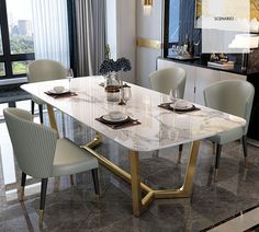 a marble dining table surrounded by white chairs