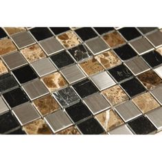 a black and brown mosaic tile pattern on a wall