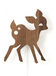 a wooden cutout of a deer