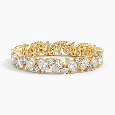 a yellow gold bracelet with pear shaped diamonds