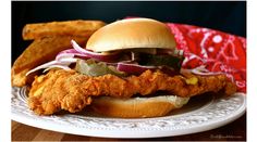 fried chicken sandwich and french fries on a plate