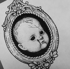 a black and white drawing of a baby in a frame