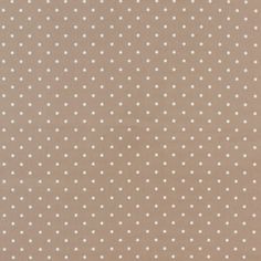 a brown background with white polka dots