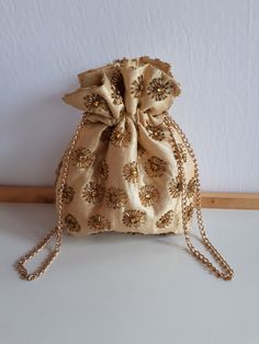 Vintage signed styled by Artel Montreal made in Honk Kong gold lurex fabric and gold glass seeds beadwork evening purse bag with gold color satin interior and chain- wedding bridal. Signed in interior. 8 x 6.5 x 1 inches. A beautiful ''something old'' for a bride! Condition: exterior; good condition ; interior: very clean - good condition - SOLD AS IS in its depicted vintage condition.  This purse was very littel used   IMPORTANT TO READ: To make this a smooth and pleasant transaction experience Fabric Glass, Lurex Fabric, Potli Bags, Evening Purse, Something Old, Gold Glass, Purse Bag, Handbag Purse, Vintage Signs