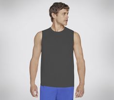 Stay dry and comfortable in bicep-friendly style wearing Skechers GO DRI Charge Muscle Tank. This sleeveless muscle tank features our soft moisture-wicking and quick-drying GO DRI fabric. | Skechers Men's GO DRI Charge Muscle Tank Top | GO DRI ALL DAY fabric is a lightweight performance jersey that has active stretch, quick dry technology and breathability to keep you cool and comfortable all day long | Sleeveless crewneck silhouette | Active Fit | 100% Polyester | Reflective Skechers logo detai Casual Athletic Fit Go-dry Muscle Tee, Casual Go-dry Muscle Tee Athletic Fit, Black Muscle Tee With Moisture-wicking Athletic Fit, Black Athletic Fit Muscle Tee With Moisture-wicking, Black Moisture-wicking Muscle Tee In Athletic Fit, Sporty Go-dry Tank Top For Sports Events, Sporty Sleeveless Muscle Tee For Sports Events, Casual Sleeveless Muscle Tee For Light Sports, Athletic Fit Go-dry Muscle Tank Tee