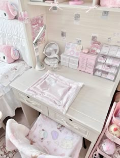 a white desk topped with lots of pink items